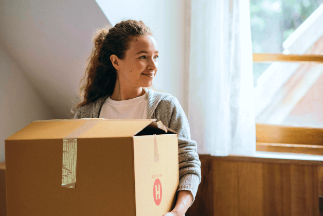 A young woman is happy to be moving into her new home
