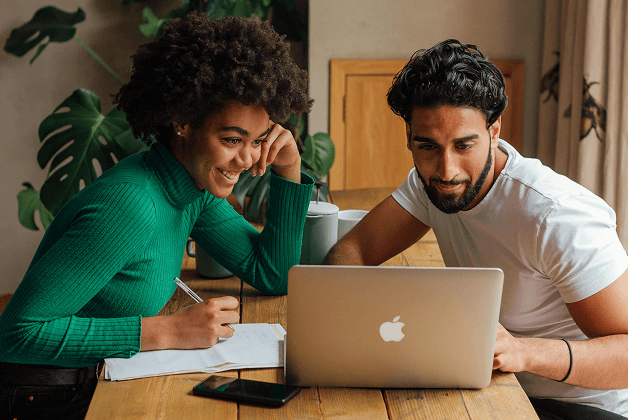 A young man uses an ATM