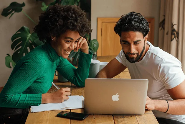 A young man uses an ATM