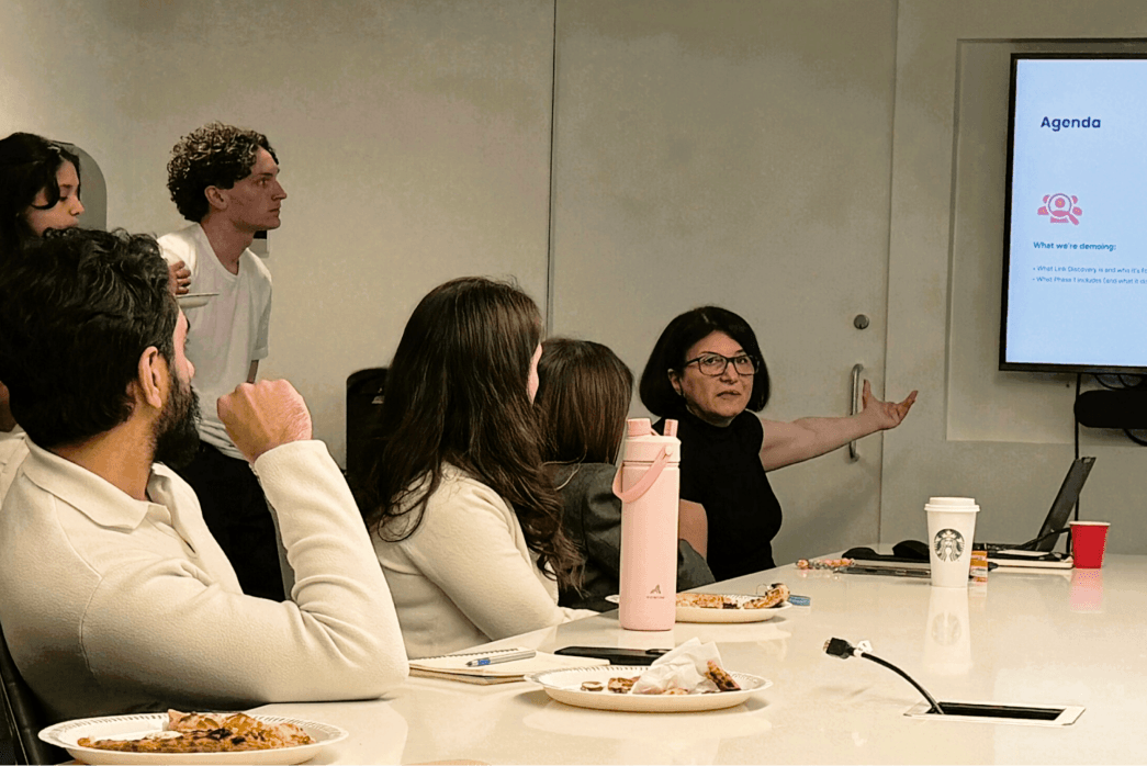 A woman doing a presentation in a board room